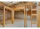 Unfinished basement is ready for your personalization with framed walls, utilities, and a smooth concrete floor at 4238 Linworth Blvd, Austell, GA 30106