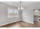Dining room features a modern light fixture and luxury vinyl flooring at 4238 Linworth Blvd, Austell, GA 30106