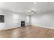 Spacious living room featuring a fireplace, ceiling fan and a door to the backyard at 4238 Linworth Blvd, Austell, GA 30106