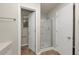 Bathroom with glass enclosed shower stall with tile flooring at 565 Lake Joyce Ln, Fairburn, GA 30213
