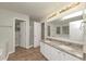 Bright bathroom featuring double sinks, granite countertops, and tile flooring at 565 Lake Joyce Ln, Fairburn, GA 30213