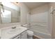 A bathroom featuring a shower and tub combo as well as a sink and vanity with storage at 565 Lake Joyce Ln, Fairburn, GA 30213