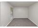 Neutral bedroom with soft carpet, a window, and ample natural light at 565 Lake Joyce Ln, Fairburn, GA 30213