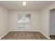 Dining area showcases neutral walls and tile flooring, plus natural light from the window at 565 Lake Joyce Ln, Fairburn, GA 30213