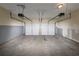 Two-car garage with ceiling mounted garage door opening systems at 565 Lake Joyce Ln, Fairburn, GA 30213