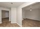 Hallway with tile flooring leading to multiple rooms, complemented by neutral wall colors at 565 Lake Joyce Ln, Fairburn, GA 30213