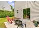 Backyard patio with outdoor seating, sliding glass door entrance, and green surroundings at 10204 Deep Creek Pl, Union City, GA 30291