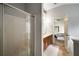 Bathroom featuring glass shower and vanity, and view of the main bedroom at 10204 Deep Creek Pl, Union City, GA 30291