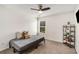 Cozy bedroom with neutral tones, a ceiling fan, a window view, and a comfortable daybed at 10204 Deep Creek Pl, Union City, GA 30291