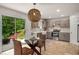 Open-concept kitchen with stainless appliances and eat-in dining with outdoor access at 10204 Deep Creek Pl, Union City, GA 30291
