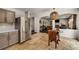 Bright eat-in kitchen area with stainless steel refrigerator and view of living room at 10204 Deep Creek Pl, Union City, GA 30291