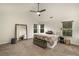 Spacious main bedroom featuring a ceiling fan, large mirror, and neutral decor at 10204 Deep Creek Pl, Union City, GA 30291
