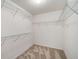 Walk-in closet with carpeted floors, wire racks, and white walls for ample storage space at 10204 Deep Creek Pl, Union City, GA 30291