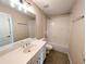 Clean bathroom featuring a white vanity, tile floors, and a shower-tub combination with a white surround at 2656 Gadsen Walk, Duluth, GA 30097