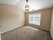 Cozy bedroom with large window for natural light, carpet floors and vaulted ceilings at 2656 Gadsen Walk, Duluth, GA 30097
