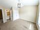 Neutral toned bedroom with carpet, closet, en suite bathroom, and a vaulted ceiling with modern light fixture at 2656 Gadsen Walk, Duluth, GA 30097