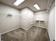 Walk-in closet with carpeted floor and shelving units at 2656 Gadsen Walk, Duluth, GA 30097