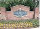 Charming Charleston Row community entrance sign surrounded by manicured flower beds at 2656 Gadsen Walk, Duluth, GA 30097