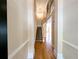 Bright foyer features hardwood floors, staircase, and a view into the living spaces at 2656 Gadsen Walk, Duluth, GA 30097
