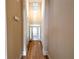 Light-filled foyer with hardwood floors and a glass-paneled front door entrance at 2656 Gadsen Walk, Duluth, GA 30097