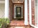 Charming brick home featuring a classic front door with sidelights and a welcoming entryway at 2656 Gadsen Walk, Duluth, GA 30097