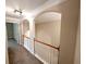 Second floor hallway features crown molding, archways, and carpet flooring at 2656 Gadsen Walk, Duluth, GA 30097