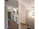 Second floor hallway with crown molding, archways, and modern light fixture at 2656 Gadsen Walk, Duluth, GA 30097