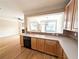 Open kitchen with hardwood floors and view into the living room at 2656 Gadsen Walk, Duluth, GA 30097