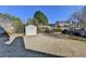 Spacious backyard with storage shed, mature trees, and manicured landscaping at 609 Grand Ashbury Ln, Buford, GA 30518