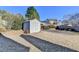 Large backyard with a storage shed and mature trees offering privacy and functionality at 609 Grand Ashbury Ln, Buford, GA 30518