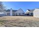 Well-maintained backyard with a shed, a brick patio, and mature trees at 609 Grand Ashbury Ln, Buford, GA 30518