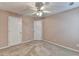 Cozy bedroom with neutral walls, carpet, and a ceiling fan at 609 Grand Ashbury Ln, Buford, GA 30518