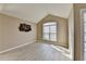 Bedroom with natural light, light hardwood floors, vaulted ceiling, and unique wall decor at 609 Grand Ashbury Ln, Buford, GA 30518