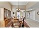 Formal dining room featuring traditional furnishings, light-colored floor, and chandelier at 609 Grand Ashbury Ln, Buford, GA 30518