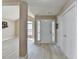 Entryway with light hardwood floors and a white front door with sidelights for a welcoming entrance at 609 Grand Ashbury Ln, Buford, GA 30518