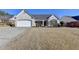 Beautiful home with a brick facade, two-car garage, and a manicured lawn at 609 Grand Ashbury Ln, Buford, GA 30518