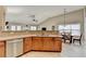 Open concept kitchen with stainless steel appliances and modern cabinetry adjacent to dining area at 609 Grand Ashbury Ln, Buford, GA 30518