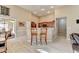 Bright living room open to kitchen and dining room, with laminate floors at 609 Grand Ashbury Ln, Buford, GA 30518