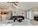 Spacious living room with fireplace, hardwood floors, plenty of natural light, and a leather sofa at 609 Grand Ashbury Ln, Buford, GA 30518
