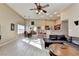 Spacious living room featuring vaulted ceilings, wood floors, and open concept design at 609 Grand Ashbury Ln, Buford, GA 30518
