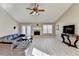 Open living room with hardwood floors, vaulted ceilings, leather sofa, fireplace and plenty of space at 609 Grand Ashbury Ln, Buford, GA 30518
