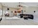 Open concept living room and dining area with wood floors at 609 Grand Ashbury Ln, Buford, GA 30518