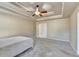 Bright and spacious main bedroom with tray ceiling and carpet floors at 609 Grand Ashbury Ln, Buford, GA 30518