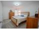 Neutral bedroom with light-colored walls, wood furnishings, and soft carpet at 93 Richmond Way, Villa Rica, GA 30180