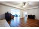 Spacious bedroom featuring hardwood floors and neutral paint with furniture throughout the room at 93 Richmond Way, Villa Rica, GA 30180