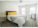 Bright bedroom with light-colored walls, bedside tables, carpet and natural light at 93 Richmond Way, Villa Rica, GA 30180