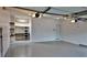 Clean, painted garage with epoxy floors and storage shelving, lit by modern lighting at 93 Richmond Way, Villa Rica, GA 30180
