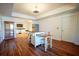 Open kitchen area with an island, light wood floors, stainless appliances and dining area at 93 Richmond Way, Villa Rica, GA 30180