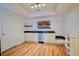 Modern kitchenette with white cabinetry and a built-in dishwasher at 93 Richmond Way, Villa Rica, GA 30180