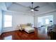 Bright living room with hardwood floors, tray ceilings, ceiling fan, and lots of natural light at 93 Richmond Way, Villa Rica, GA 30180